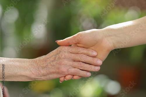 Helping hands, care for the elderly concept © Mike Sagan