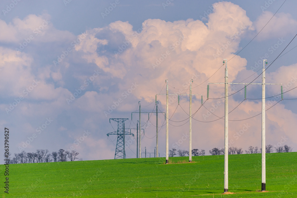 Rural landscape with high-voltage line on sunset