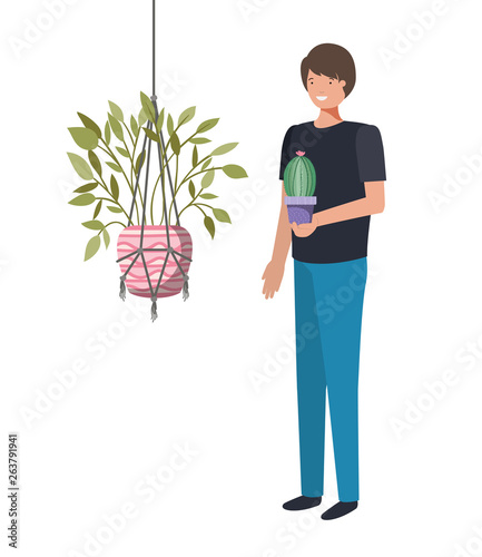 man with cactus in macrame hangers