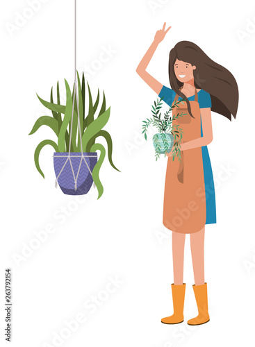 woman with houseplant on macrame hangers