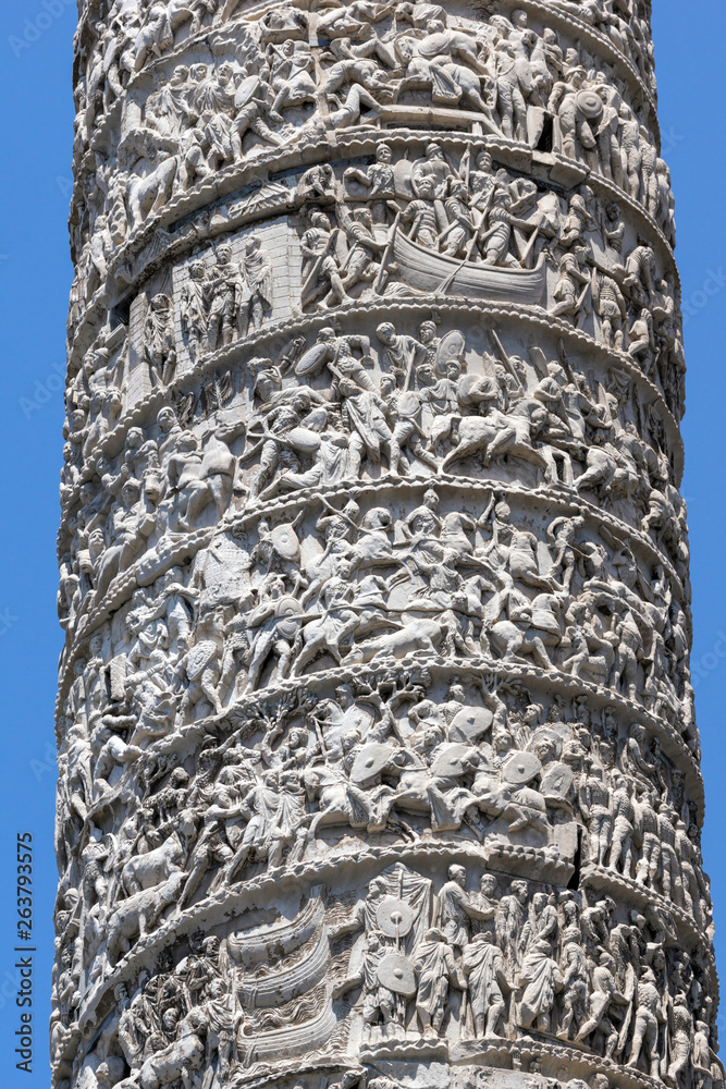 Architectural detail from of ancient Marcus Aurelius Column in front of Palazzo Chigi in city of Rome, Italy