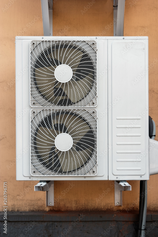 Close-up of Industrial cooling machine with two fans on the wall Close-up of Industrial cooling machine with two fans on the wall