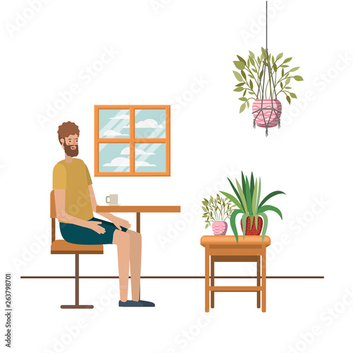 man drinking coffee in the living room