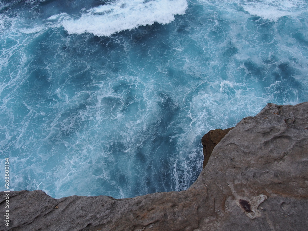 cliff and sea waves, blue ocean and rock