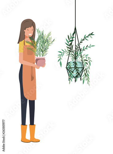 woman with houseplant on macrame hangers