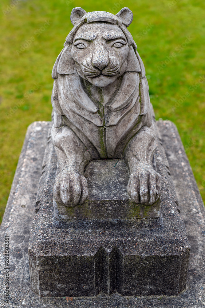 Small stone lion statue in the Stanley Park close to the Lions Gate Bridge