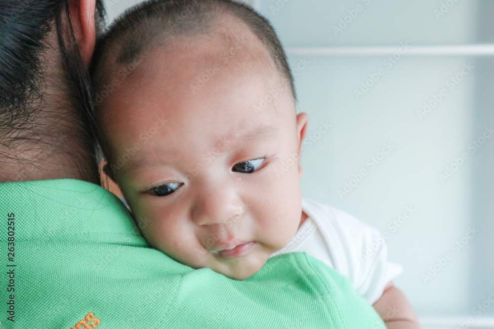 Mother holding her infant baby boy Mother holding her infant baby boy