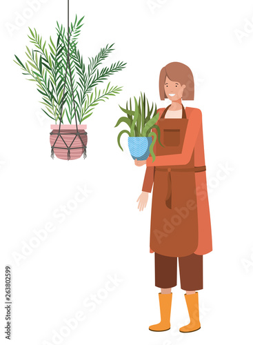 woman with houseplant on macrame hangers