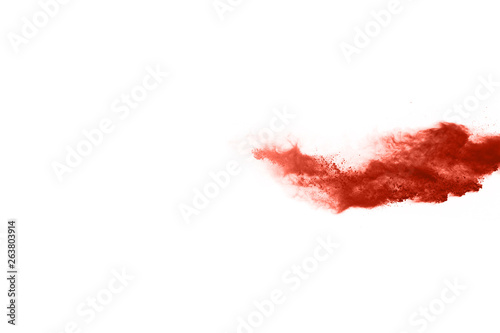 living coral color powder explosion on white background. Colored cloud. Colorful dust explode. Paint Holi.