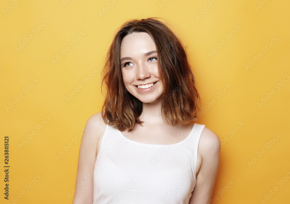 Portrait of young positive female with cheerful expression Portrait of young positive female with cheerful expression