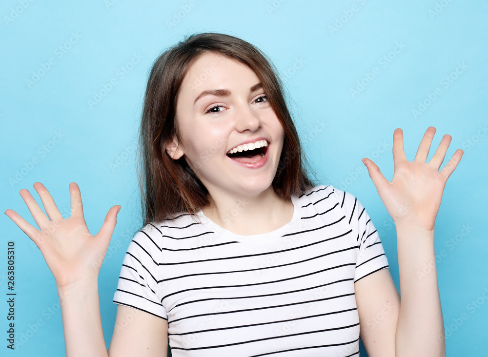 Portrait of young positive female with cheerful expression Portrait of young positive female with cheerful expression