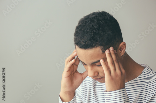 Sad African-American teenag...