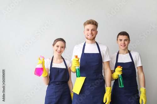 Portrait of janitors with b...