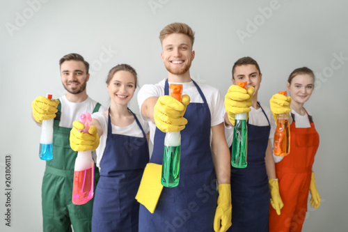 Portrait of janitors with b...