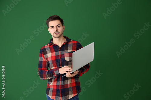 Male programmer with laptop...