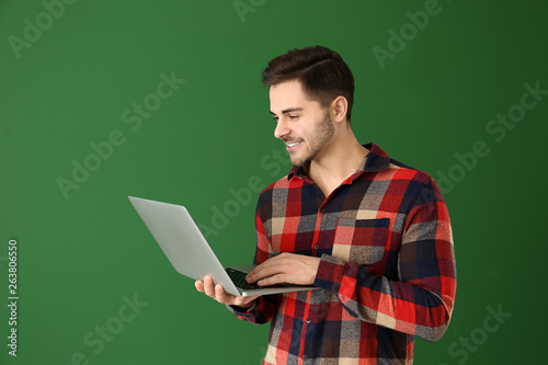 Male programmer with laptop...