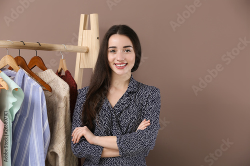 Young woman standing near c...