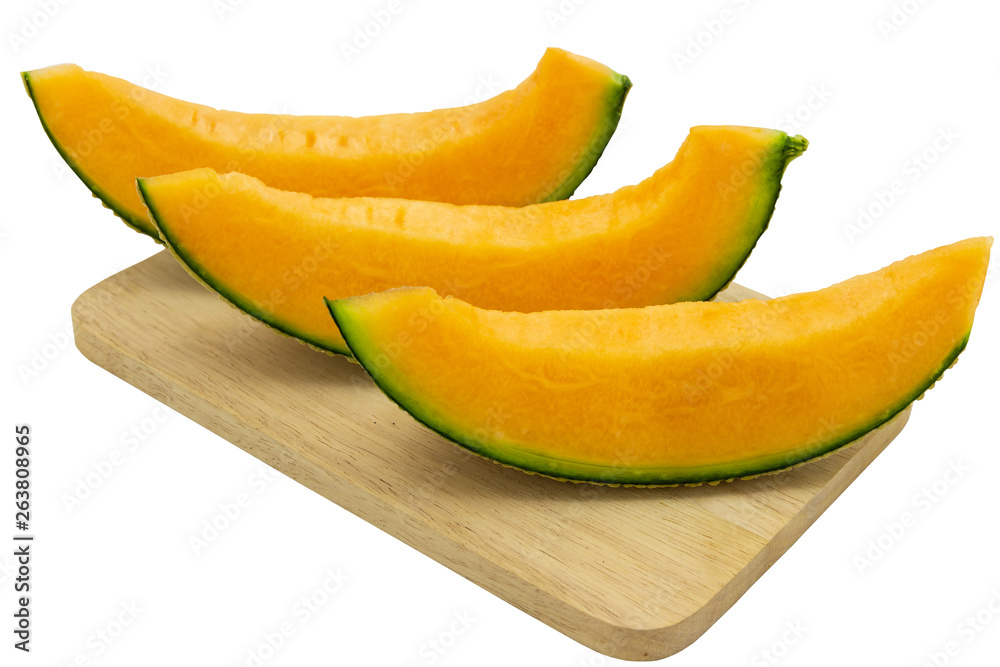 Closeup melon bright colors that is pieces on wooden tray isolated on white background. clipping path