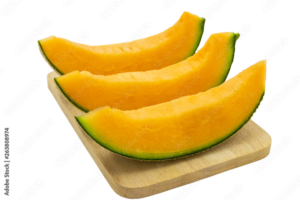 Closeup melon bright colors that is pieces on wooden tray isolated on white background. clipping path