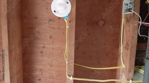 Changing Light Bulb on Basement Ceiling and Turning On SLIDE UP AND STOP photo