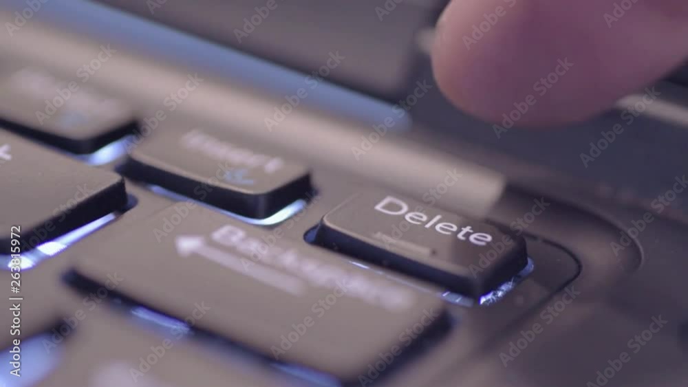 Pressing delete key on a laptop Pressing delete key on a laptop