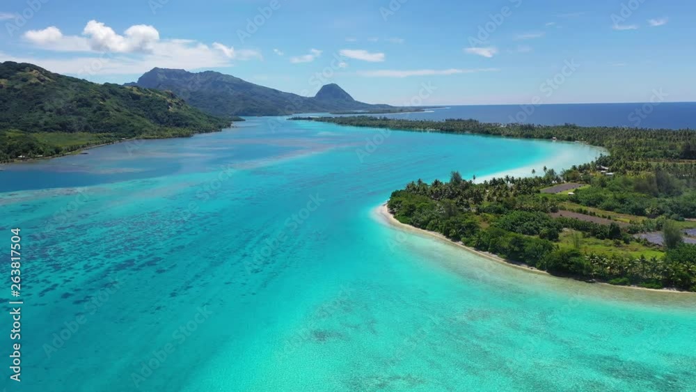 Aerial drone view of French Polynesia Tahiti island Huahine and Motu coral reef lagoon and Pacific Ocean. Tropical paradise. Aerial drone view of French Polynesia Tahiti island Huahine and Motu coral reef lagoon and Pacific Ocean. Tropical paradise.