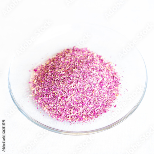 Damask Rose dried in a bowl isolated on white background