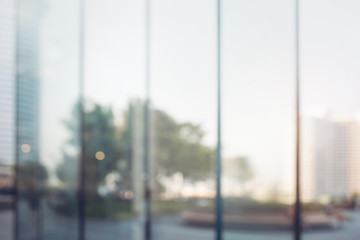 Blurred abstract glass wall from building in city town