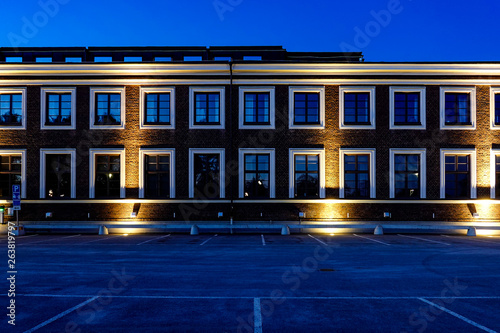 Sandviken, Sweden A n old building lit up at night. photo