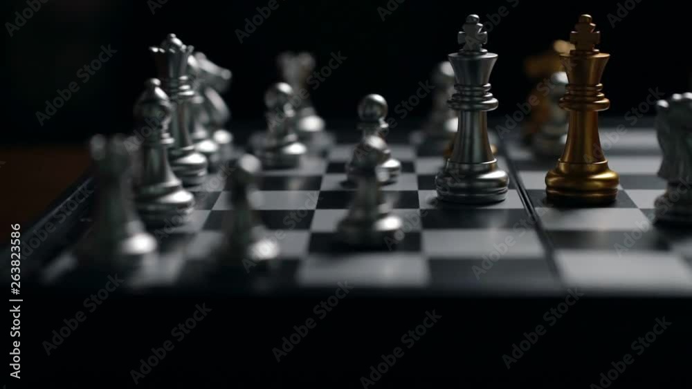 Close up man moving silver king chess defeat enemy on chessboard winner and victory concept,strategy planning business Slowmotion Close up man moving silver king chess defeat enemy on chessboard winner and victory concept,strategy planning business Slowmotion