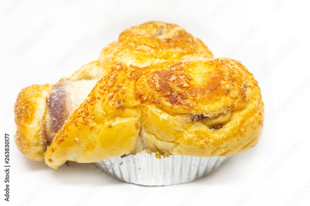 Buttered bread, sugar and stuffed with sausage on a white background Buttered bread, sugar and stuffed with sausage on a white background