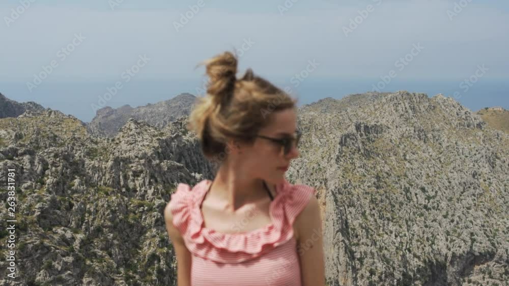 Out of focus silhouette of woman standing by high mountains in Mallorca, Spain Out of focus silhouette of woman standing by high mountains in Mallorca, Spain