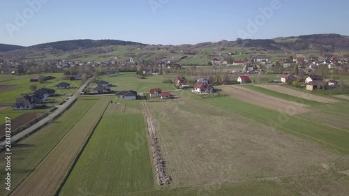 Biezdziadka, Poland - 4 9 2019: Panorama from a bird's eye view. Central Europe: The Polish village of Kolaczyce is located among the green hills. Temperate climate. Flight drones or quadrocopter. photo