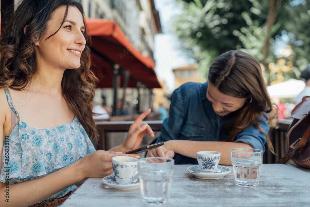 Young Beautiful Women Having a Coffee in Florence . Italy Young Beautiful Women Having a Coffee in Florence . Italy