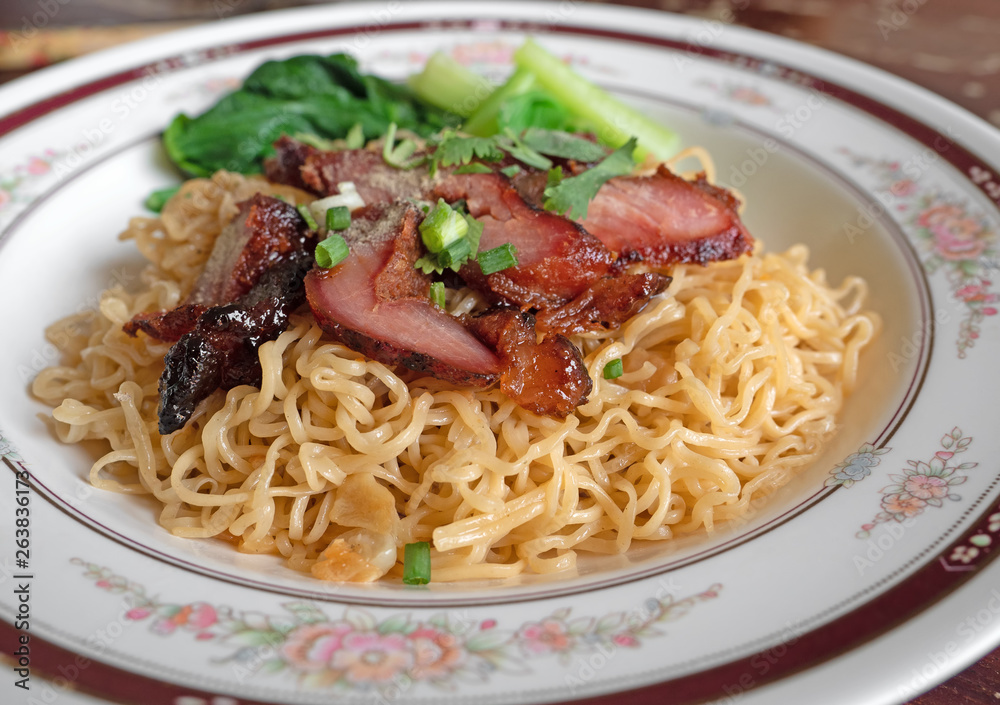 Close up Dry Egg Noodles with Red Roasted Pork and Green Bok Choy Close up Dry Egg Noodles with Red Roasted Pork and Green Bok Choy