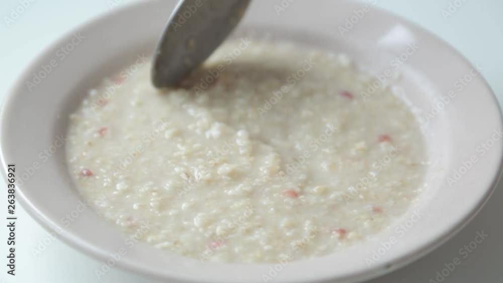 Preparation and brewing with boiling water. Oatmeal in a plate for Breakfast. Preparation and brewing with boiling water. Oatmeal in a plate for Breakfast.