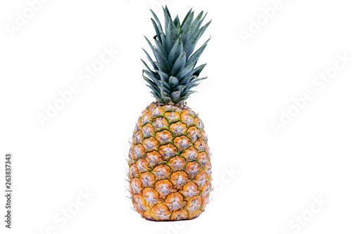Background of full size of pineapple isolated on white background with copy space.