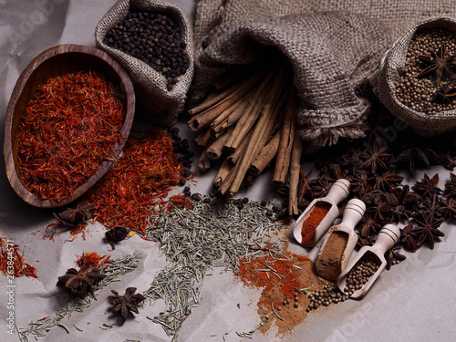 Set of colorful dry seed and powder on wood background on top view. Food art concept. Asian Herbs in Kitchen.