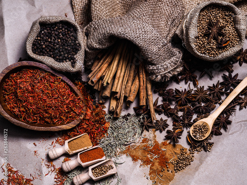 Set of colorful dry seed and powder on wood background on top view. Food art concept. Asian Herbs in Kitchen.