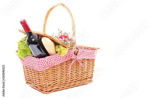 picninc basket with wine, cheese and fruit