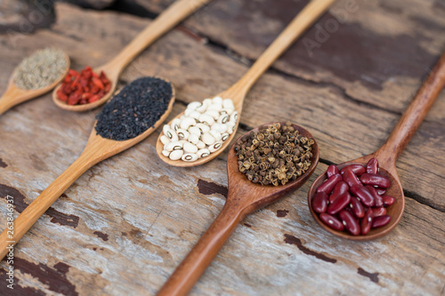 Cereal grains , seeds, beans,spices on wooden background. photo