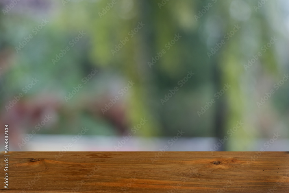 Empty dark wooden table in front of abstract blurred bokeh background of restaurant . can be used for display or montage your products.Mock up for space. Empty dark wooden table in front of abstract blurred bokeh background of restaurant . can be used for display or montage your products.Mock up for space.