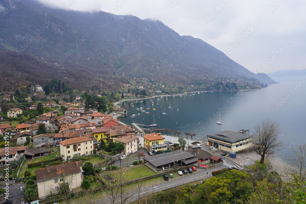  bird eye view of a small village by the shore of lake Lugano, Italy
