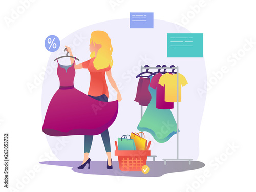 Womens shopping. The girl is trying on a dress
