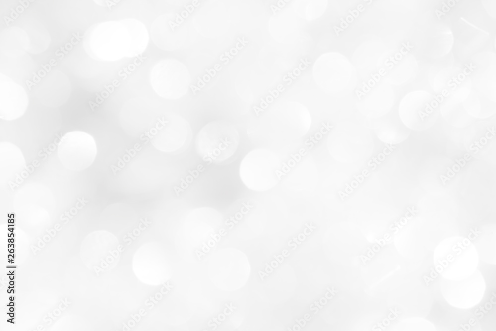 A brilliant white background with circles and ovals. Template for a holiday card with bright and sparkling lights.
