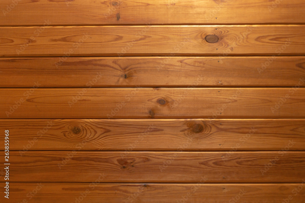 Fototapeta premium grunge background: plank surface, varnished boards, yellow lights on top