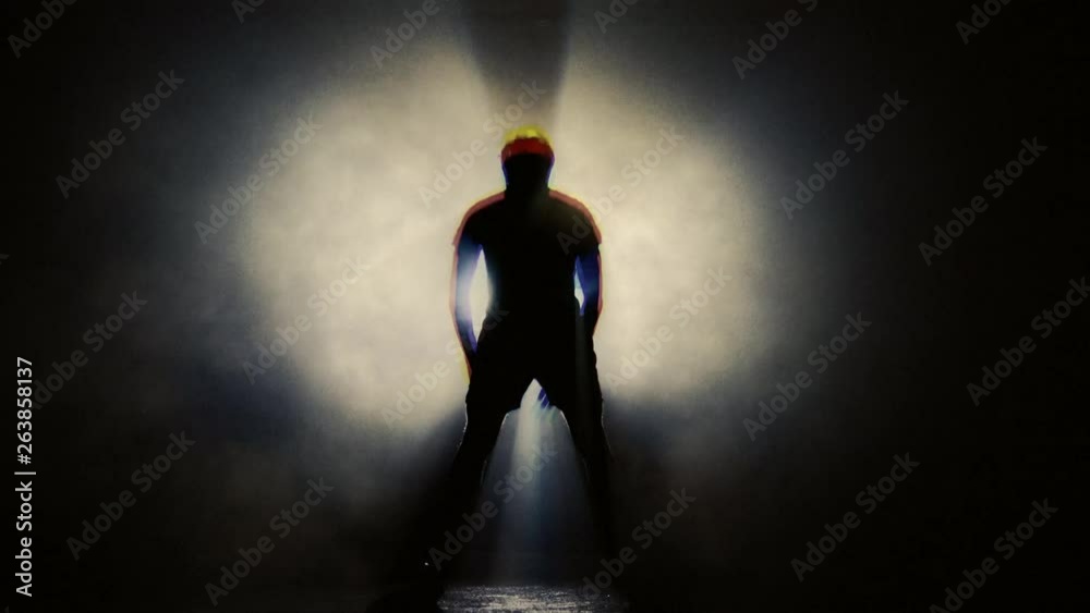 Training Presses in Smoky Studio. Silhouette on Dark background Training Presses in Smoky Studio. Silhouette on Dark background
