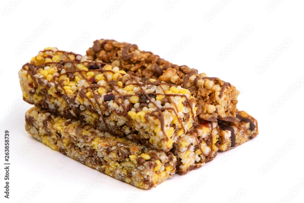 vegan dessert: several cereal bars with raisins and honey, isolated on white, short focus vegan dessert: several cereal bars with raisins and honey, isolated on white, short focus