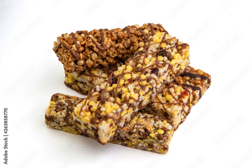 vegan dessert: several cereal bars with raisins and honey, isolated on white, short focus vegan dessert: several cereal bars with raisins and honey, isolated on white, short focus