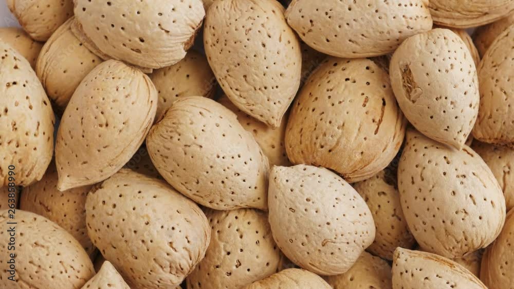Almonds abstract background, top view. Rotating Almonds abstract background, top view. Rotating